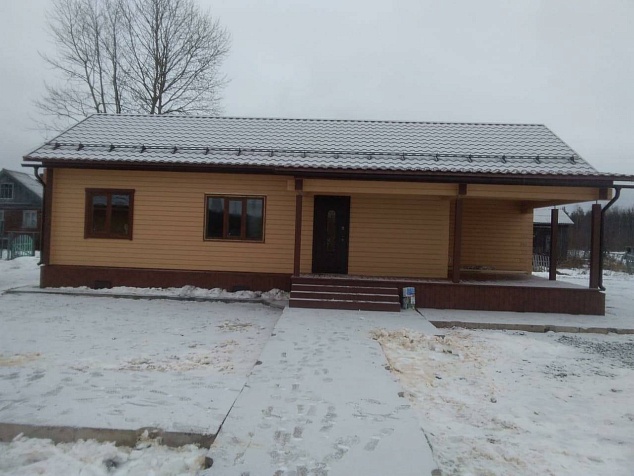 Закончено строительство дома и гаража из сухого бруса в Архангельской области под Онегой