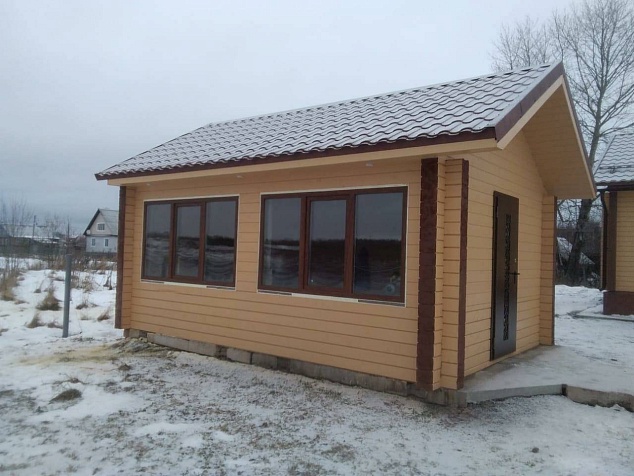Закончено строительство дома и гаража из сухого бруса в Архангельской области под Онегой